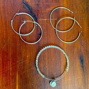Two pairs of silver hoops and silver Alex and Ani bracelet